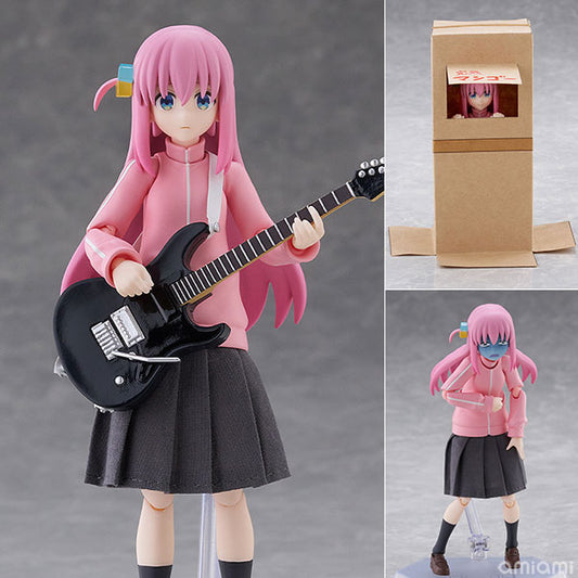 Anime figurine of a pink-haired girl with blue eyes, wearing a pink jacket and black pleated skirt, holding a black electric guitar. The main view shows the figure standing, with two smaller inset views showing the back of the cardboard box packaging and the figure inside the box.