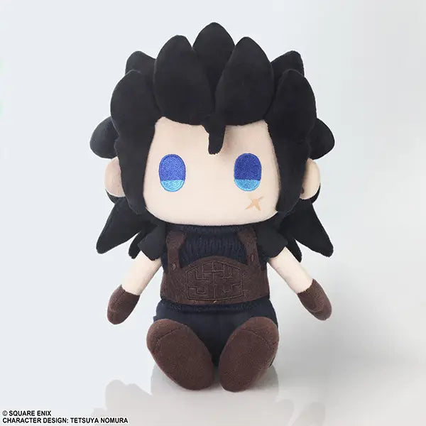 A chibi-style plush toy with black spiky hair, large blue eyes, a cream face, and a dark brown outfit, photographed against a clean white background.