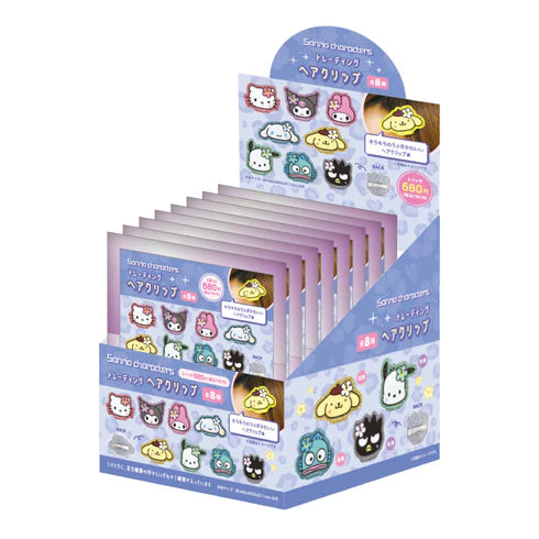 Display box of Sanrio character hair clips on a white background