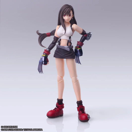 Action figure with long dark hair, white top, black skirt, and red boots on a gray background