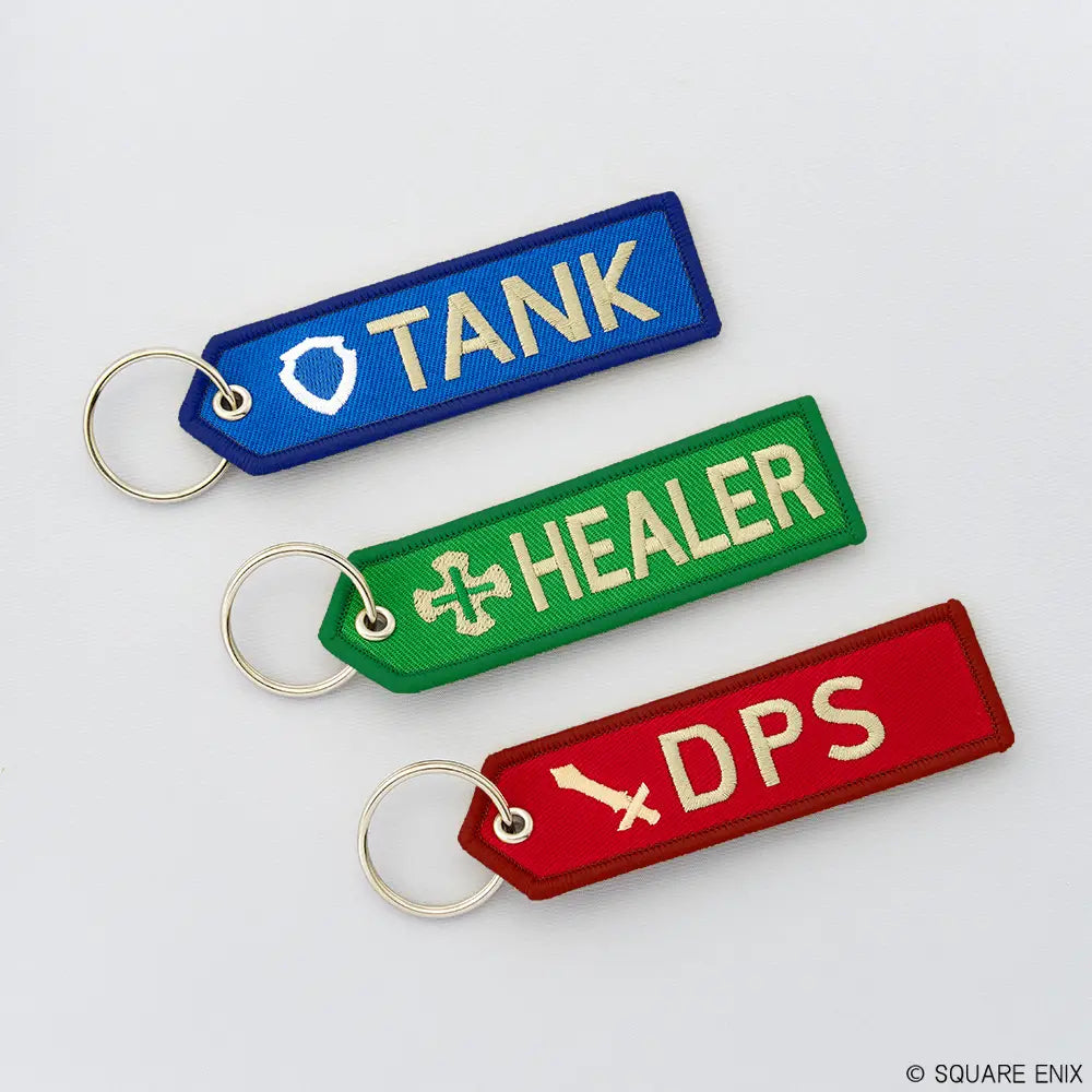 Three keychains labeled 'TANK', 'HEALER', and 'DPS' on a light gray background.