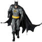 Batman action figure with cape and cowl on a white background