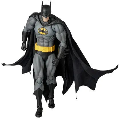 Batman action figure with cape and cowl on a white background