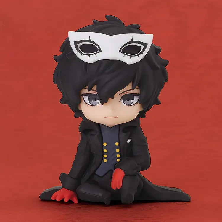 A chibi-style collectible figure of a dark-haired character wearing a white masquerade mask, black coat, and red gloves, posed against a solid red background.