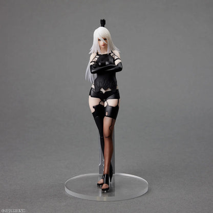 Action figure of a character in black and white attire on a gray background