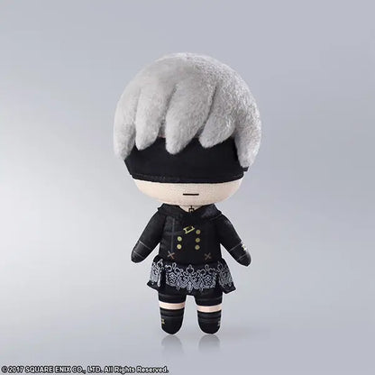 Plush toy of a character with gray hair and black outfit on a gray background