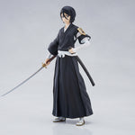Anime character figure in black traditional outfit with a sword on a white background