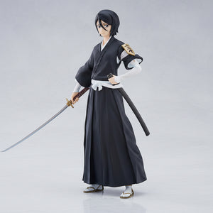 Anime character figure in black traditional outfit with a sword on a white background