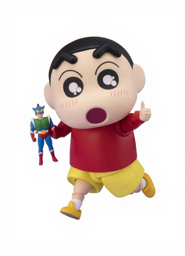 Figurine of Nohara Shinnosuke - Crayon Shin-chan in a red shirt and yellow shorts with a superhero figure in the background.