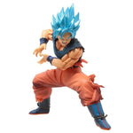 Action figure with blue hair and orange outfit on a white background