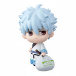 GIntama figurine with white hair and red eyes holding a bag on a white background