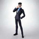 Action figure in a black suit with sunglasses on a white background