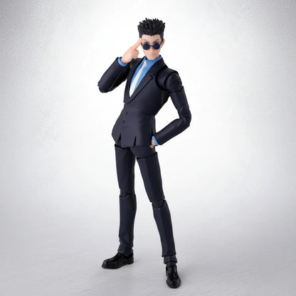Action figure in a black suit with sunglasses on a white background