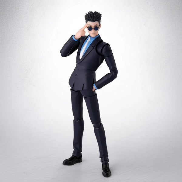 Action figure in a black suit with sunglasses on a white background