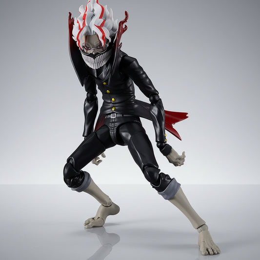 Action figure with a black outfit and red accents on a white background