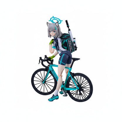 Figurine of a character with cat ears riding a bicycle on a white background